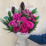 Mix of 11 pink roses